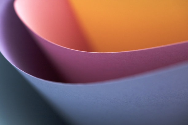 抽象的彩色纸，蓝色，粉色和橙色的背景。图片下载