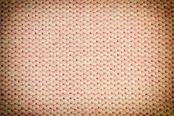 纹理，浅橙褐色针织针织物特写。空白羊毛背景布局。照片和装饰图案。图片下载