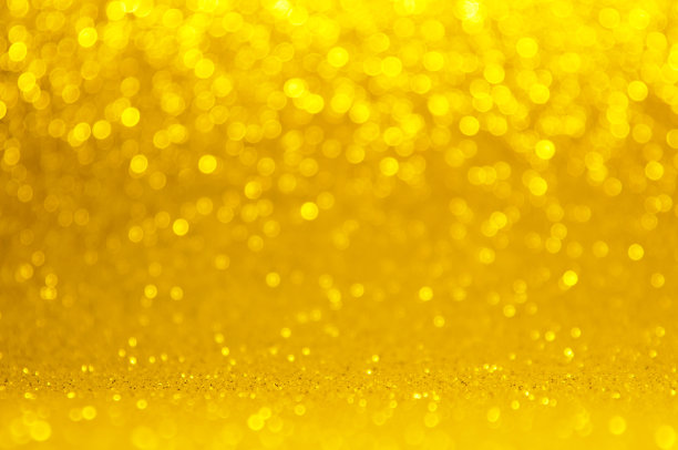 金色、黄色的散景，圆形抽象的灯光背景，粉色金色的闪亮灯光，闪闪发光的圣诞、新年彩灯。模糊抽象的假日背景。图片下载