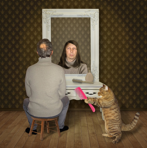 男人和他的猫拿着梳子图片下载