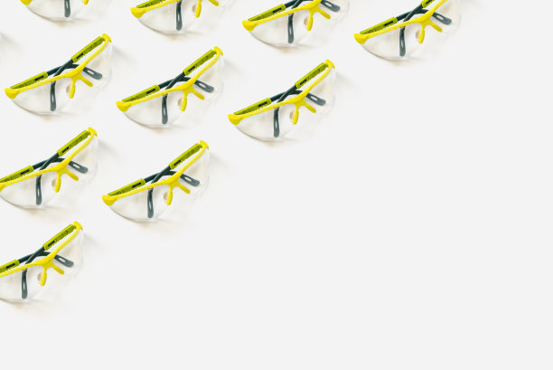 安全眼镜亮绿色在浅白色的背景。用于设计的模式图片下载