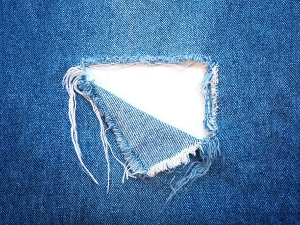 蓝色牛仔布的撕裂图案图片下载