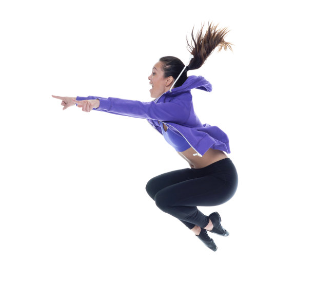 美丽的女性穿着运动服开心的跳上跳下图片下载