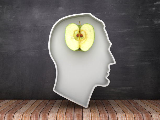 人的头部形状与苹果在黑板上的背景- 3D渲染图片下载