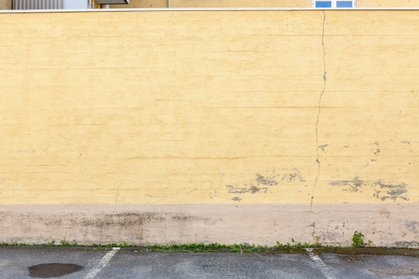外面破旧的黄色混凝土墙图片下载