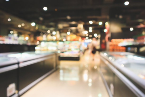 抽象超市过道内部模糊散焦背景与散焦光图片下载