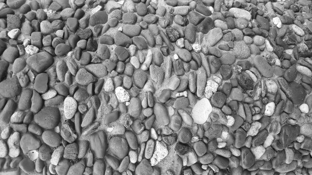 背景纹理在混凝土墙上许多小的灰色鹅卵石图片下载