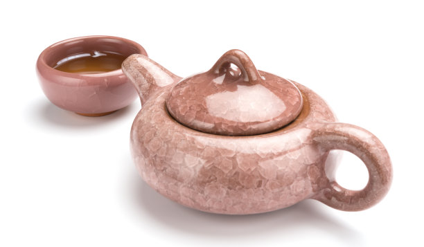 白色背景上的茶壶和一杯茶图片下载