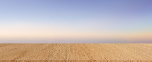 抽象模糊的自然日落天空与柔和的色调颜色梯度背景和现代奶油木背景纹理桌面广告，显示和推广的内容或产品展示图片下载
