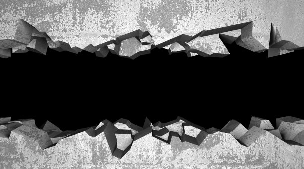 混凝土墙上有一个黑色的裂缝和破洞图片下载