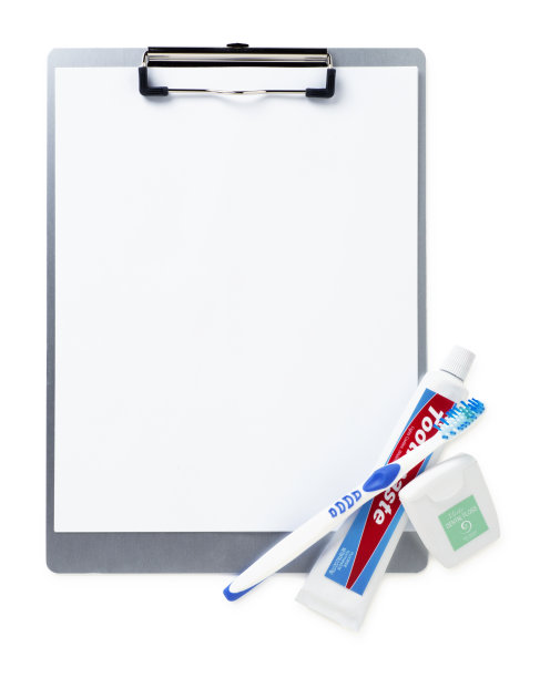 剪贴板和牙科清洁用品图片下载