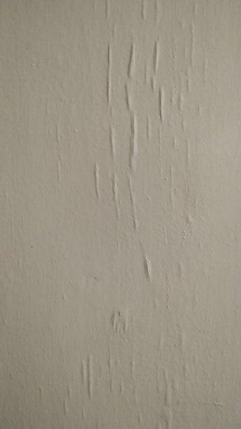 用白色油漆涂的灰泥墙。背景、模式。特写镜头。图片下载