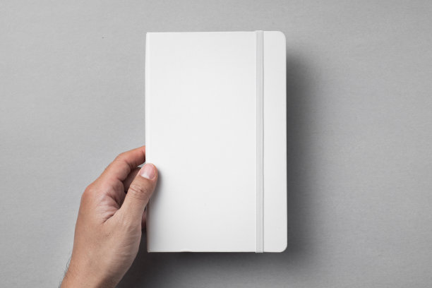 白色笔记本孤立在灰色背景图片下载