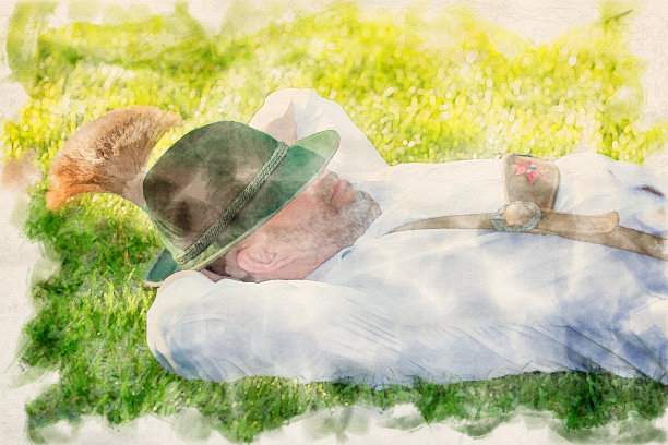 身着传统巴伐利亚服装的男子穿着水彩画睡在草地上图片下载