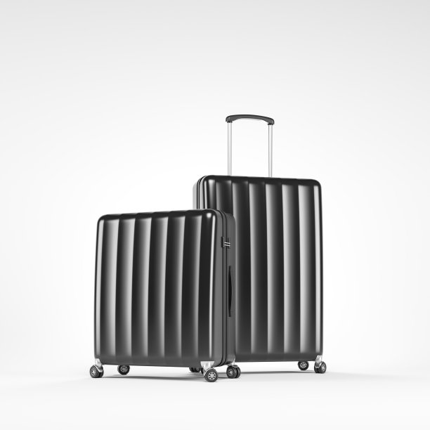 白色行李箱上盖着两个黑色行李箱图片下载