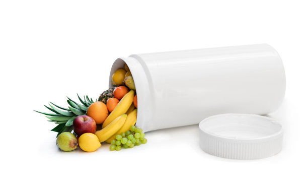 把你的药片换成新鲜水果。天然概念从天然热带水果中提取维生素补充剂图片下载