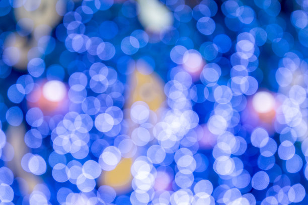 模糊的散景灯光背景，圣诞和新年假期背景。图片下载