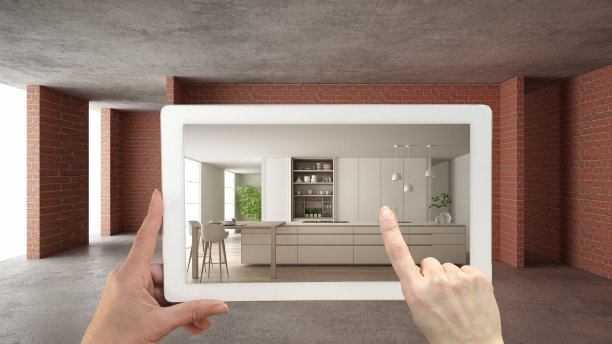 增强现实的概念。带有AR应用的手持平板，用于模拟室内建筑现场的家具和设计产品，带有岛和凳子的现代厨房图片下载