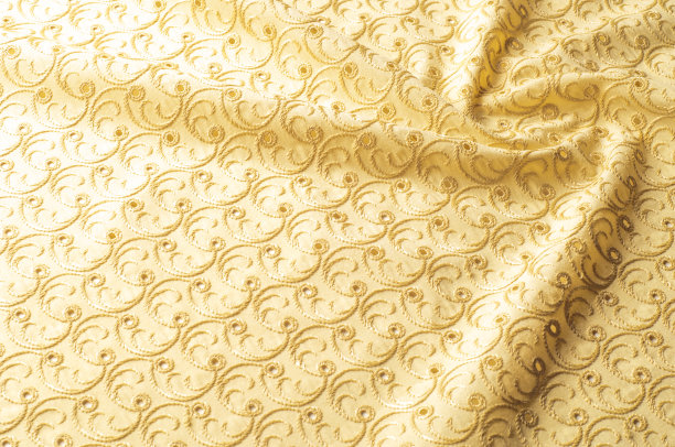 壁纸纹理。面料浅米色，有绣花图案，打孔。宽网眼棉花边织物的院子图片下载