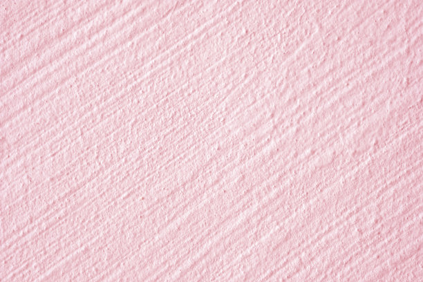 特写粗糙的粉红色帕特尔混凝土外墙设计的纹理和背景。图片下载
