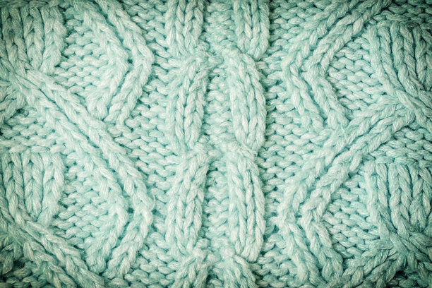 针织纹理与图案特写。空白的绿松石背景布局。照片和装饰图案。图片下载