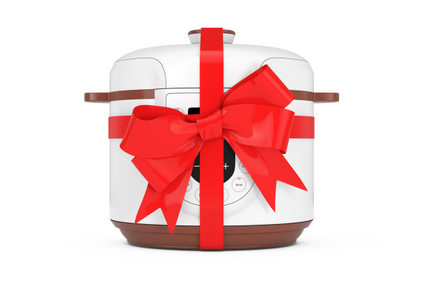现代电饭煲与红丝带和蝴蝶结。3d渲染图片下载
