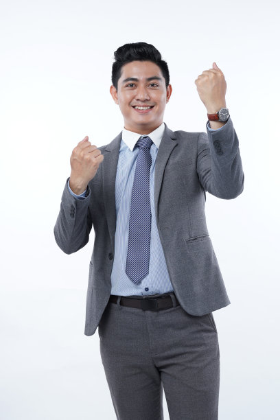 亚洲年轻英俊的男性办公室工作人员在智能休闲西装，孤立在白色背景图片下载