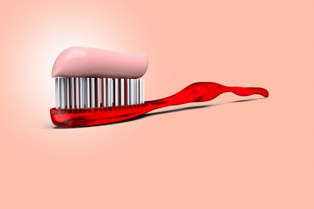 红色背景上印有牙膏的红色牙刷图片下载