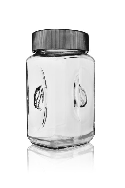 用塑料盖盖上的速溶咖啡空罐。在一个白色的背景反射。图片下载