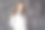 笑容满面的医生在白色制服站在灰色的背景。本空间图片下载
