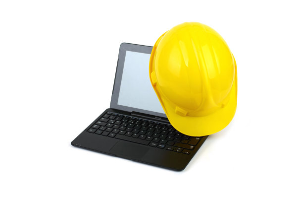 黄色安全帽和笔记本电脑图片下载