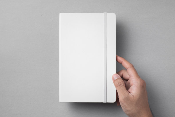 白色笔记本孤立在灰色背景图片下载