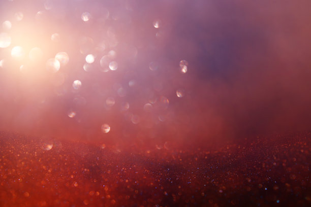 抽象闪烁灯光背景。红色、黑色、紫色和金色。de-focused图片下载