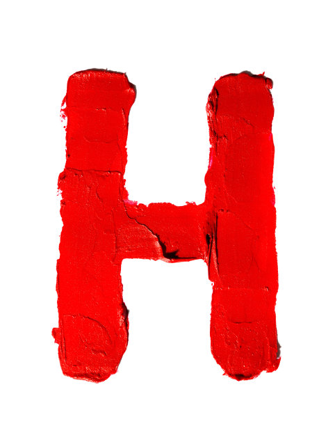 手写大英文大写字母H制成的模糊的红色唇膏孤立在白色背景。剪下图片下载