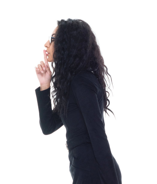 迷人的拉丁女商人做的是安静的手势图片下载