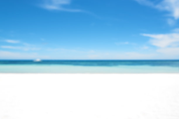 美丽的白色沙滩与大海和蓝天模糊抽象背景图片下载