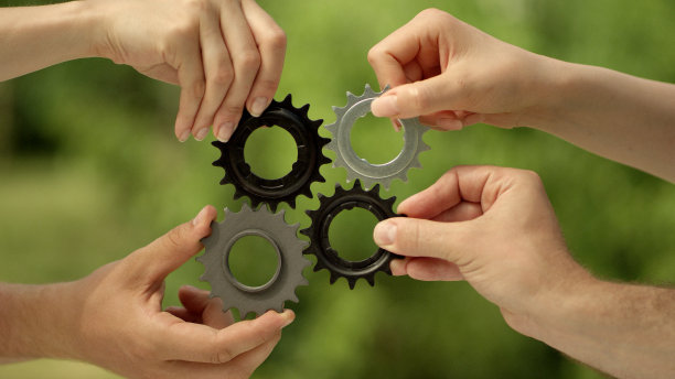 匹配的齿轮齿轮。团队合作的比喻图片下载