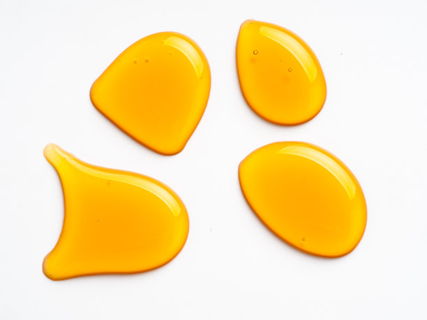 蜂蜜滴，孤立白色图片下载