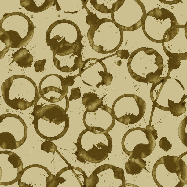 深棕色的斑点和咖啡溅在浅棕色的背景上图片下载