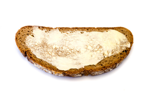 白色背景上的黄油面包图片下载