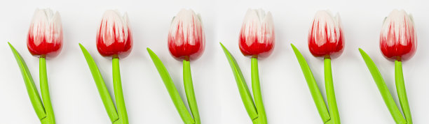 人造花装饰，木制的红色郁金香在白色的背景。花朵图案装饰图片下载