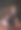 美丽的年轻女子坐在飘落的花瓣下图片下载