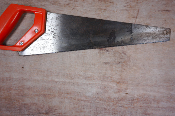 橙色手锯木制背景与复制空间为您自己的文本图片下载