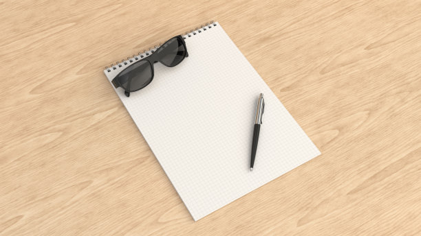 戴墨镜和钢笔的笔记本图片下载
