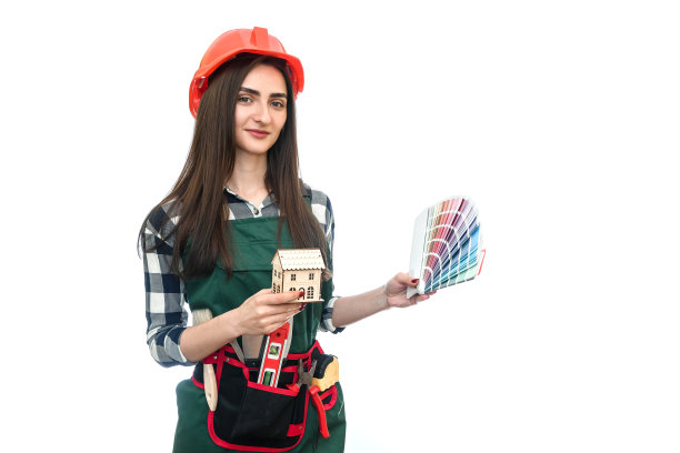 穿着工装的漂亮女人，带着工具和色卡图片下载