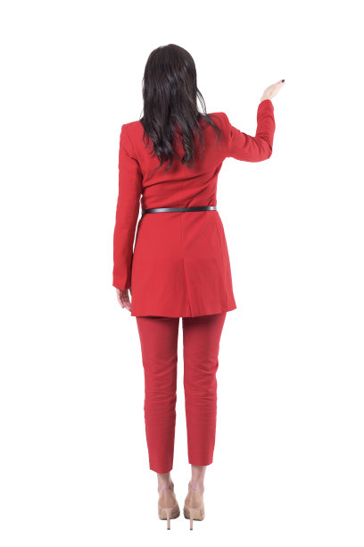 年轻优雅的商业销售女人的背影展示与张开的手掌的copyspace。图片下载