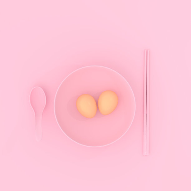 煎蛋用勺子和筷子盛在盘子里，呈粉红色图片下载