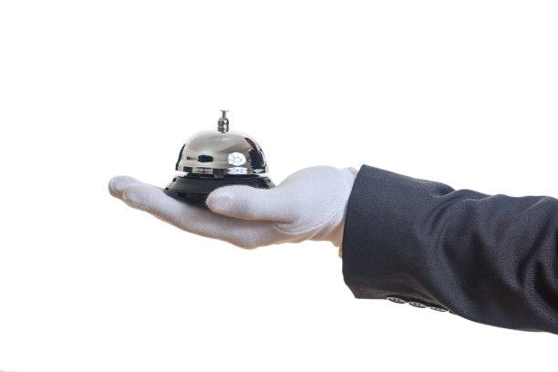 戴着手套的手里拿着管家服务铃图片下载
