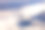 雪山的背景和白云在他们之上。从飞机窗户拍摄的航拍照片。图片下载
