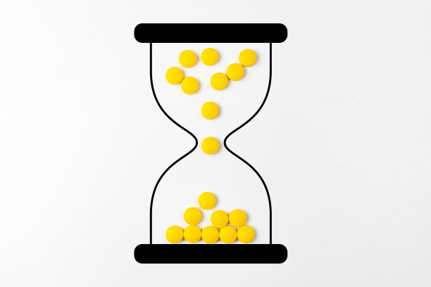 药丸沙漏剂量表-概念上的沙漏图片下载